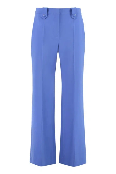 Shop Moschino Flared Trousers In Blue