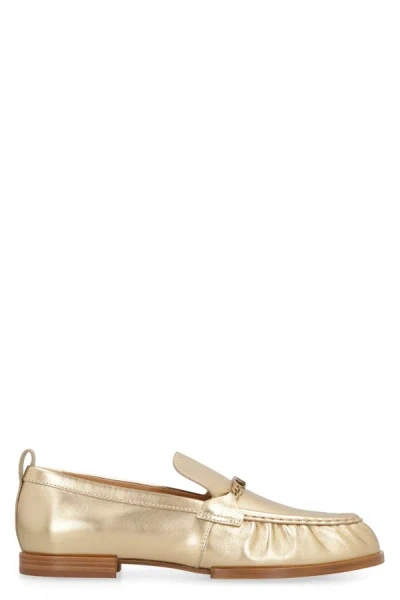 Shop Tod's Metallic Leather Loafers In Gold
