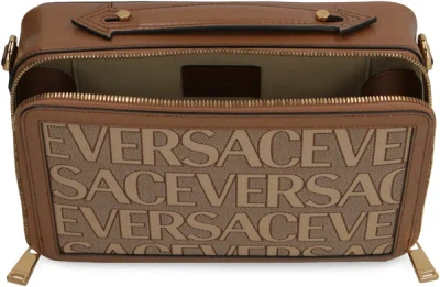 Shop Versace Canvas Messenger Bag In Beige