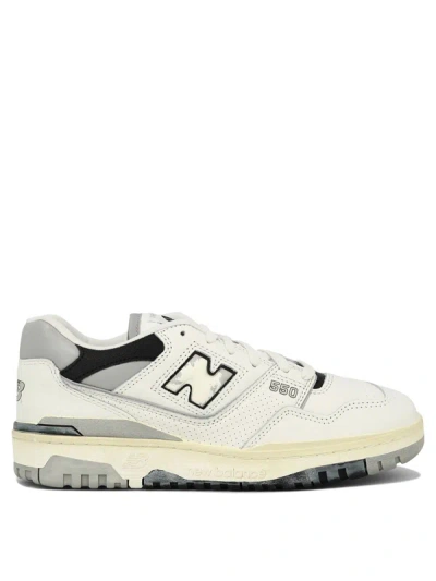 Shop New Balance "550" Sneakers