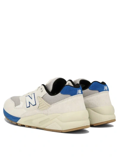 Shop New Balance "580" Sneakers