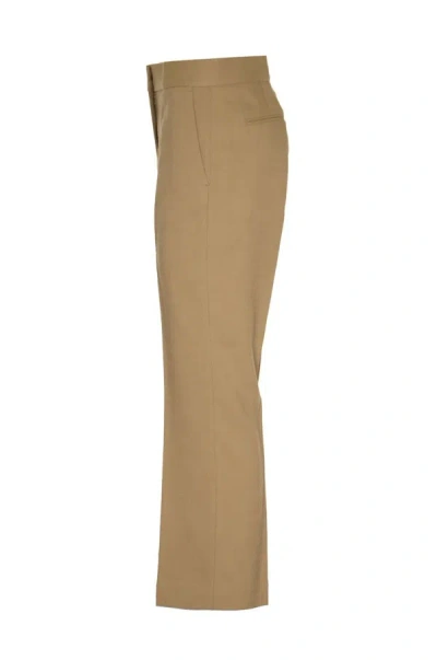 Shop Msgm Trousers In Sand