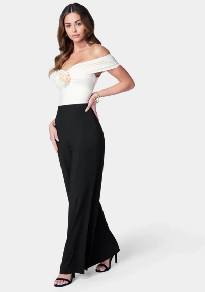 Bebe Off Shoulder Rosette Jumpsuit In Black,ivory
