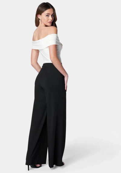 Bebe Off Shoulder Rosette Jumpsuit In Black,ivory