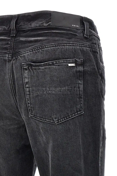 Shop Amiri Men 'release Hem' Jeans In Black