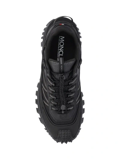 Shop Moncler Sneakers In Black