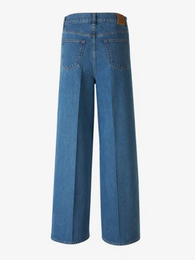 Shop Totême Wide Leg Jeans In Ironed Pleat Detail