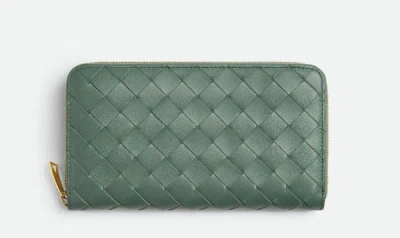 Shop Bottega Veneta Intrecciato Zip Around Wallet In Green