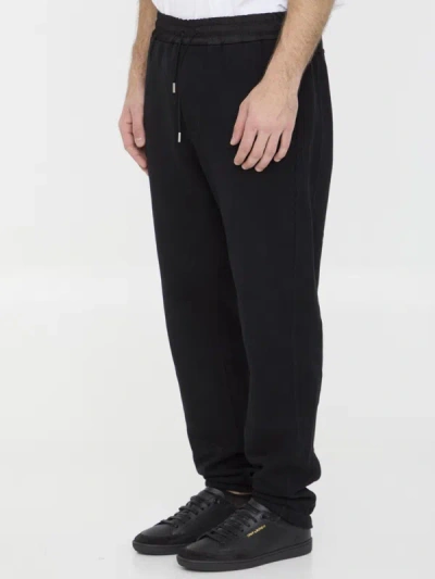 Shop Saint Laurent Track Pants In Black