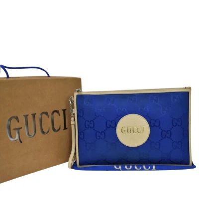 Shop Gucci Off The Grid Blue Canvas Clutch Bag ()