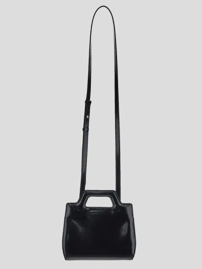 Shop Ferragamo Salvatore  Handbags. In Black Black