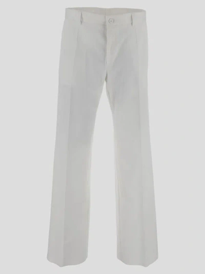 Shop Dolce & Gabbana Trousers In Biancoottico