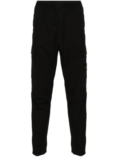 Shop Stone Island Pants With Compass In Black