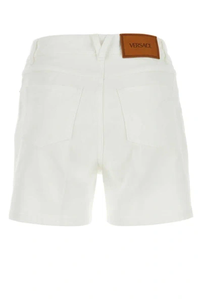 Shop Versace Shorts In White
