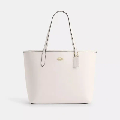 Shop Coach Outlet City Tote In Gold