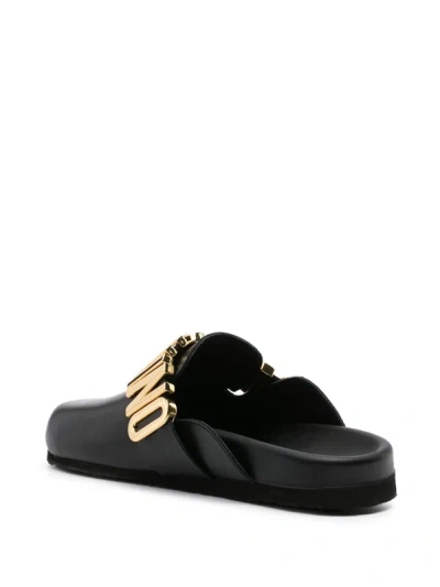 Shop Moschino Mules With Logo In Black