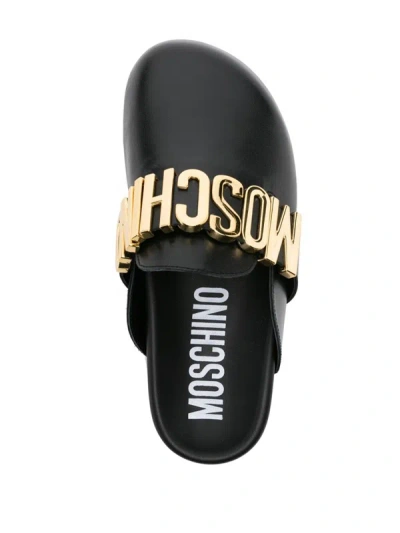 Shop Moschino Mules With Logo In Black