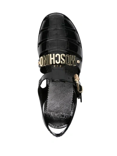 Shop Moschino Sandals With Logo Plaque In Black