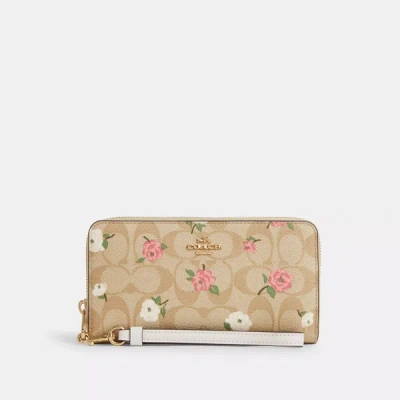 Shop Coach Outlet Long Zip Around Wallet In Signature Canvas With Floral Print In Multi