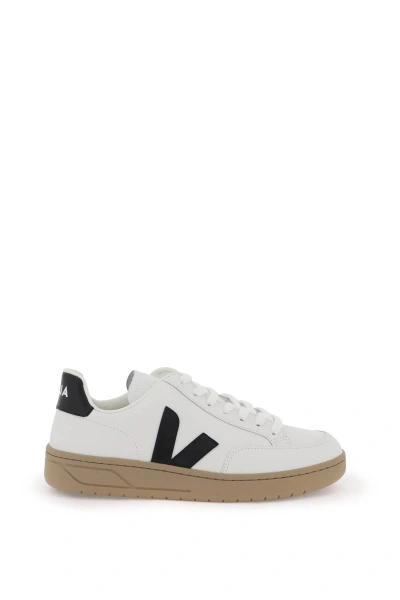 Shop Veja Leather V 12 Sneakers In White, Black
