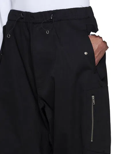 Shop Random Identities Trousers In Black