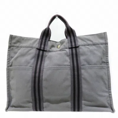 Shop Hermes Hermès Grey Canvas Tote Bag ()