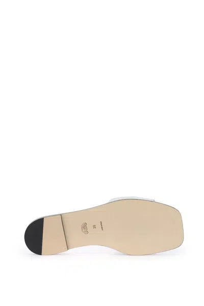 Shop Alexander Mcqueen Laminated Leather Slides With Embossed Seal Logo