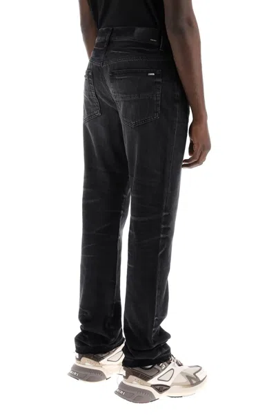 Shop Amiri Straight Cut Loose Jeans Men In Black