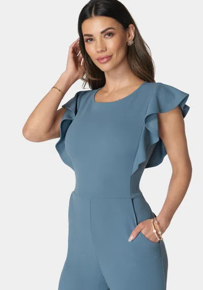 Bebe Flutter Sleeve Core Jumpsuit In Denim