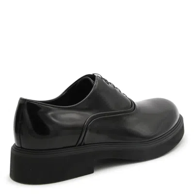 Shop Ferragamo Flat Shoes Black