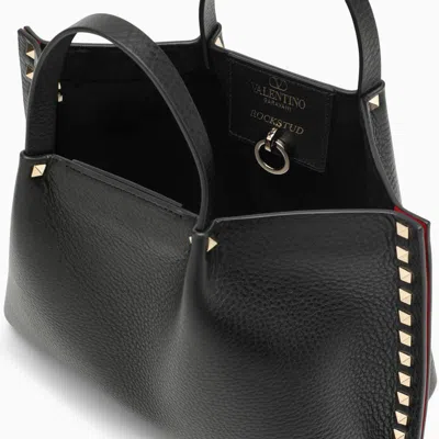 Shop Valentino Garavani Rockstud Handbag In Garnet Calfskin In Black