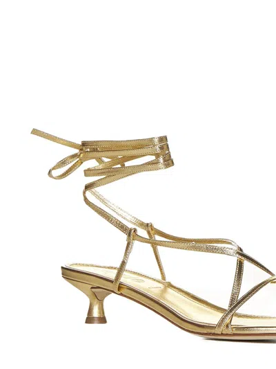 Shop Aeyde Sandals In Golden