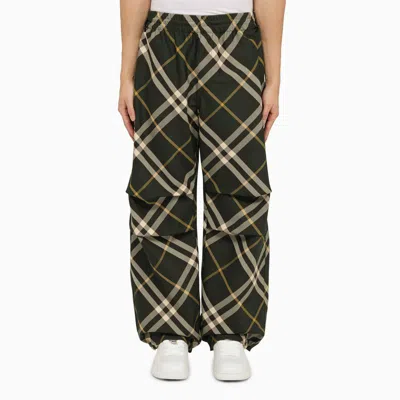Shop Burberry Green Trousers With Check Pattern