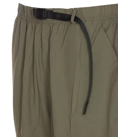 Shop Gramicci Trousers In Verde