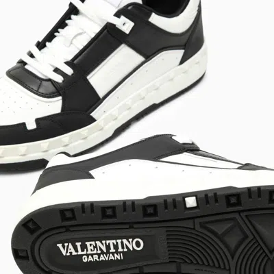 Shop Valentino Garavani Low Top Freedots Trainer In Black/white Calfskin