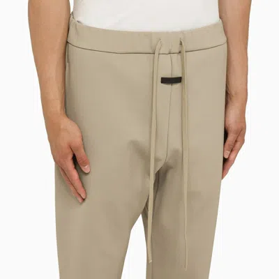 Shop Fear Of God Eternal Trousers Dusty Beige Men In Cream