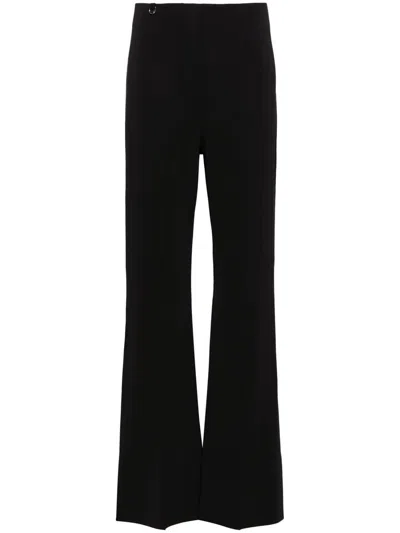 Shop Jacquemus Apollo Flared Trousers In Black