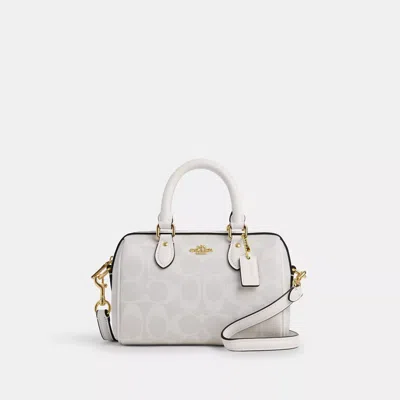 Shop Coach Outlet Mini Rowan Crossbody In Signature Canvas In White