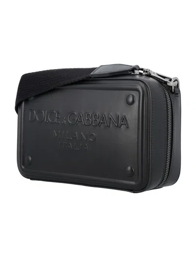 Shop Dolce & Gabbana Embossed Logo Cross-body Bag In Black