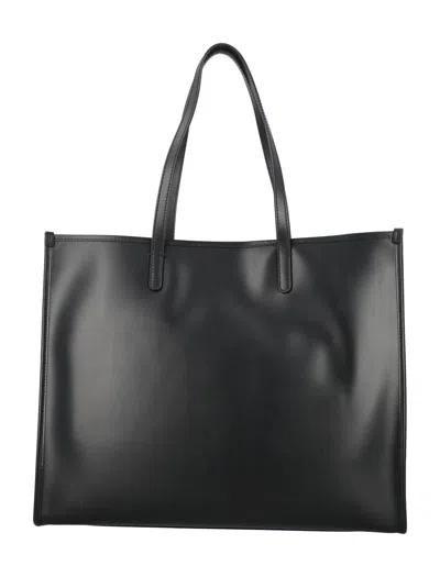 Shop Dolce & Gabbana Shopper With Embossed Logo In Black