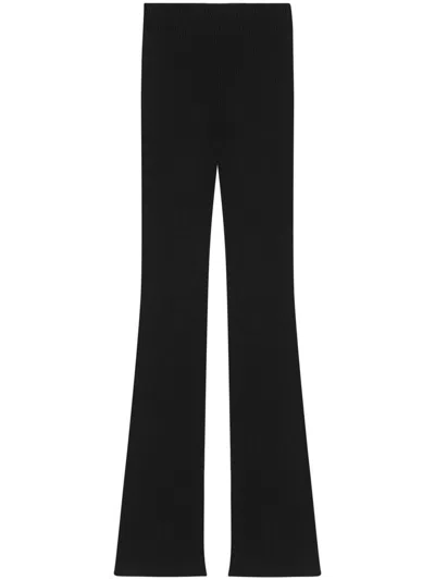 Shop Saint Laurent Flared Wool Trousers In Black