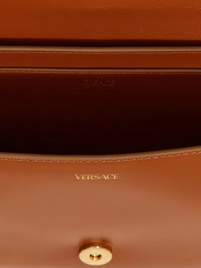 Shop Versace 'greca' Handbag In Brown