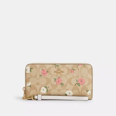 Shop Coach Outlet Long Zip Around Wallet In Signature Canvas With Floral Print In Beige