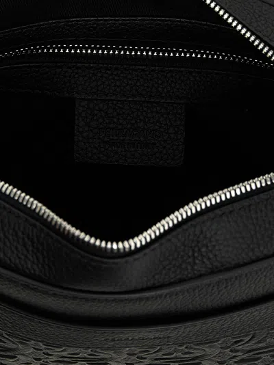 Shop Ferragamo Embossed Logo Shoulder Strap Crossbody Bags Black