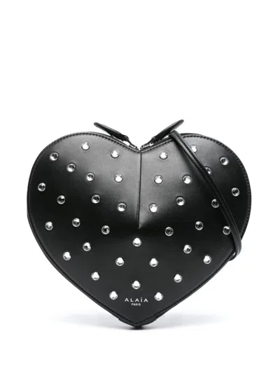 Shop Alaïa Le Cœur Leather Crossbody Bag In Black