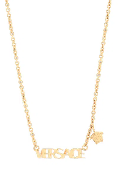 Shop Versace Lettering Logo Necklace In Gold