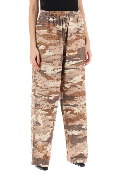 Shop Acne Studios Camouflage Jersey Pants For Men In Beige