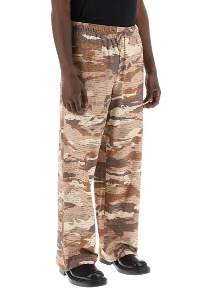 Shop Acne Studios Camouflage Jersey Pants For Men In Beige