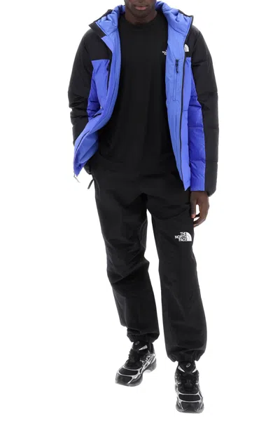 Shop The North Face Himalayan Short Hooded Down Jacket In Black,blue