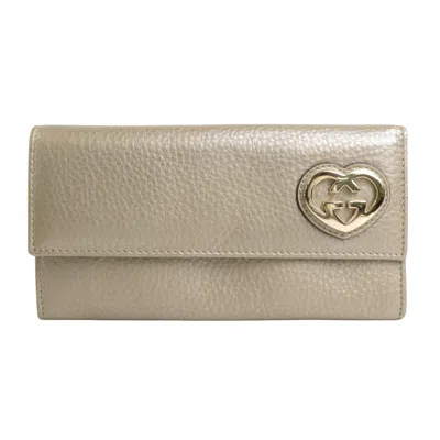 Shop Gucci Interlocking Gold Leather Wallet  ()
